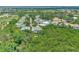 Aerial view of houses in a community near water and a golf course at 14080 Willow Glen Ct # 233, Port Charlotte, FL 33953