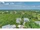 Aerial view of a house in a lush green community at 14080 Willow Glen Ct # 233, Port Charlotte, FL 33953