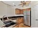 Modern kitchen with stainless steel appliances and granite countertops at 14080 Willow Glen Ct # 233, Port Charlotte, FL 33953