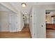 Bright hallway with hardwood floors and access to bedrooms and kitchen at 14080 Willow Glen Ct # 233, Port Charlotte, FL 33953