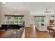 Kitchen with granite countertops, hardwood floors, and view of living room at 14080 Willow Glen Ct # 233, Port Charlotte, FL 33953