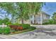 Two-story house with a two-car garage and lush landscaping at 14080 Willow Glen Ct # 233, Port Charlotte, FL 33953