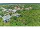 Aerial view of houses in a community surrounded by lush greenery at 14080 Willow Glen Ct # 233, Port Charlotte, FL 33953