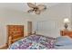 Bedroom with ceiling fan, dresser, and large closet at 14080 Willow Glen Ct # 233, Port Charlotte, FL 33953