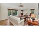 Bright living room with hardwood floors, comfortable seating, and large windows at 14080 Willow Glen Ct # 233, Port Charlotte, FL 33953