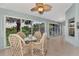 Spacious lanai with glass enclosure, wicker furniture and tranquil view at 14080 Willow Glen Ct # 233, Port Charlotte, FL 33953