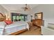 Main bedroom with wood flooring and ensuite bathroom access at 14080 Willow Glen Ct # 233, Port Charlotte, FL 33953