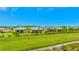 Aerial view of homes featuring backyard patios and green spaces at 1445 Hyssop Loop, North Port, FL 34289