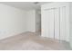 Empty bedroom with carpet flooring and a closet at 19524 Fishhawk Trl, Venice, FL 34293