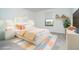 Bright bedroom featuring a colorful comforter, modern decor, and a window at 19524 Fishhawk Trl, Venice, FL 34293