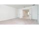 Large bedroom features neutral carpet, bright lighting, and white trim at 19524 Fishhawk Trl, Venice, FL 34293