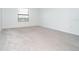 Clean and bright empty bedroom with neutral carpet, simple trim, and blinds at 19524 Fishhawk Trl, Venice, FL 34293