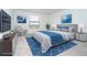 Staged bedroom with large window and modern decor and furniture at 19524 Fishhawk Trl, Venice, FL 34293