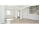 Bright and airy entryway with tile flooring, leading to staircase and other rooms at 19524 Fishhawk Trl, Venice, FL 34293