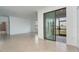 Living room with sliding glass doors leading to a patio at 19524 Fishhawk Trl, Venice, FL 34293