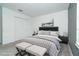 Staged primary bedroom featuring stylish furniture, decor, and ample natural light at 19524 Fishhawk Trl, Venice, FL 34293