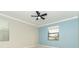 Bright bedroom featuring neutral walls and a ceiling fan at 19536 Fishhawk Trl, Venice, FL 34293