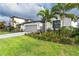 One-story house with attached garage and landscaping at 19536 Fishhawk Trl, Venice, FL 34293