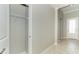 Front hallway with tile floor, neutral walls, and closet at 19536 Fishhawk Trl, Venice, FL 34293