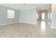 Spacious living room with neutral walls, crown molding, and tile floors, perfect for comfortable living at 19536 Fishhawk Trl, Venice, FL 34293