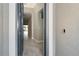 Open door revealing a view of the interior hallway at 19536 Fishhawk Trl, Venice, FL 34293