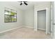 Spacious bedroom with neutral walls, plush carpet, and a large closet at 19536 Fishhawk Trl, Venice, FL 34293