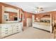 Main bedroom with light walls, ceiling fan, and dresser at 3 Pinehurst Ct, Rotonda West, FL 33947