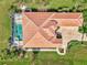 Aerial view showcasing the home's layout, pool, and surrounding landscape at 3031 Rivershore Ln, Port Charlotte, FL 33953