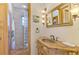 Bathroom with glass block shower, copper sink, and tiled floors at 3060 Rivershore Ln, Port Charlotte, FL 33953