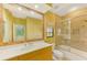 Updated bathroom with a large mirror, a walk-in shower, and a tiled floor at 3060 Rivershore Ln, Port Charlotte, FL 33953