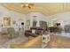 Elegant living room with leather sofas, high ceilings, and a decorative ceiling at 3060 Rivershore Ln, Port Charlotte, FL 33953