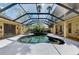 Stunning pool and spa with covered patio and abundant natural light at 3060 Rivershore Ln, Port Charlotte, FL 33953