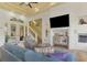 Comfortable living room with large TV, seating area, and tile floors at 3060 Rivershore Ln, Port Charlotte, FL 33953