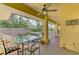 Private deck with glass-top table, chairs, and tranquil views at 3060 Rivershore Ln, Port Charlotte, FL 33953