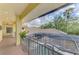 Balcony overlooking the pool and surrounding landscape at 3060 Rivershore Ln, Port Charlotte, FL 33953