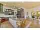 Eat-in kitchen with large island, custom cabinetry, and access to Gathering room at 3060 Rivershore Ln, Port Charlotte, FL 33953