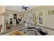 Sitting room with hardwood floors, large windows, and access to a deck at 3060 Rivershore Ln, Port Charlotte, FL 33953