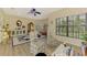 Bright sitting room with hardwood floors, large windows, and comfortable seating at 3060 Rivershore Ln, Port Charlotte, FL 33953