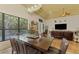 Spacious dining area with a view of the living room and access to the backyard at 3060 Rivershore Ln, Port Charlotte, FL 33953