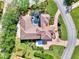 Aerial view of a luxurious home with a tile roof and a pool at 3060 Rivershore Ln, Port Charlotte, FL 33953