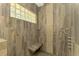Walk-in shower with pebble floor and glass block window at 3060 Rivershore Ln, Port Charlotte, FL 33953