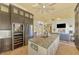 Luxury kitchen features a wine cooler, granite countertops, and stainless steel appliances at 3060 Rivershore Ln, Port Charlotte, FL 33953