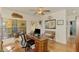 Home office with built-in desk and plenty of natural light at 3060 Rivershore Ln, Port Charlotte, FL 33953