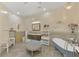 Spa-like bathroom with a clawfoot tub, modern vanity, and tiled floors at 3060 Rivershore Ln, Port Charlotte, FL 33953