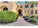 Elegant entryway with a wrought-iron gate and manicured landscaping at 3060 Rivershore Ln, Port Charlotte, FL 33953