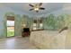 Bedroom with nature mural and light wood floors at 3060 Rivershore Ln, Port Charlotte, FL 33953