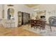 Charming dining room with terracotta floors, a wooden table, and decorative wall art at 3060 Rivershore Ln, Port Charlotte, FL 33953