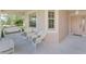 Relaxing front porch with white wicker seating at 3270 Bay Ridge Way, Port Charlotte, FL 33953