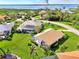 Aerial view of waterfront homes with lush landscaping and community at 3270 Bay Ridge Way, Port Charlotte, FL 33953