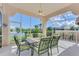 Enjoy outdoor dining on this screened porch overlooking a lake at 3270 Bay Ridge Way, Port Charlotte, FL 33953